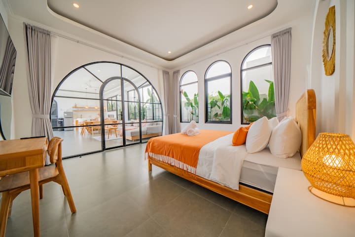 malea-Bedroom Orange Arched Windows Garden