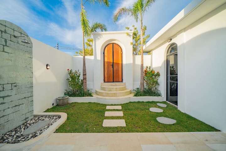 malea-Exterior Orange Door Garden Path