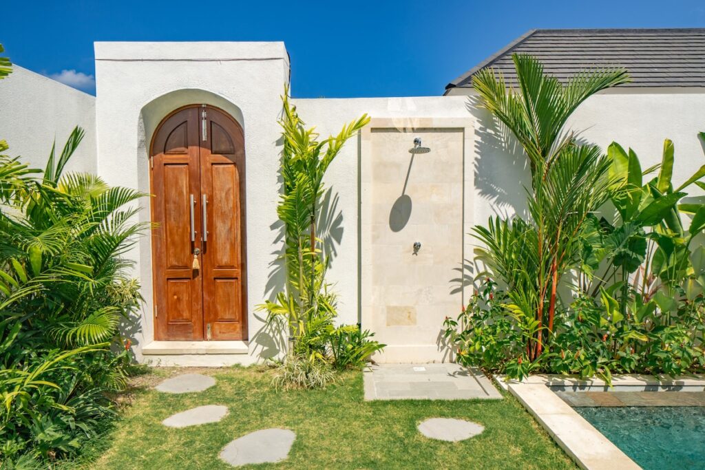 swiss-Villa entrance with tropical garden